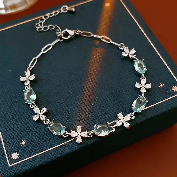60# Silver-Blue-Zircon Oval Cross Flower Bracelet,tkmbeautysupply.com