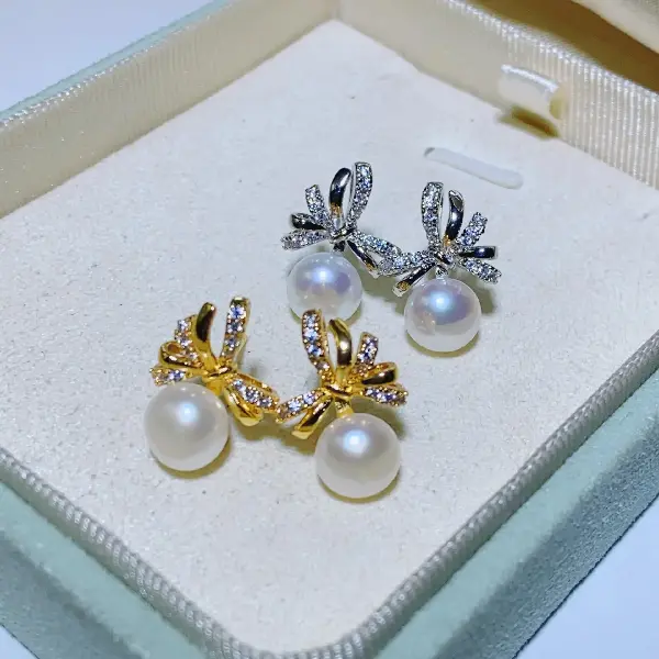 Stud earrings - gold with white pearls,tkmbeautysupply.com