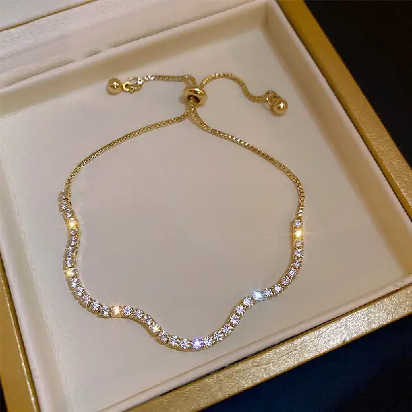 Diamond-encrusted gold wave bracelet,tkmbeautysupply.com